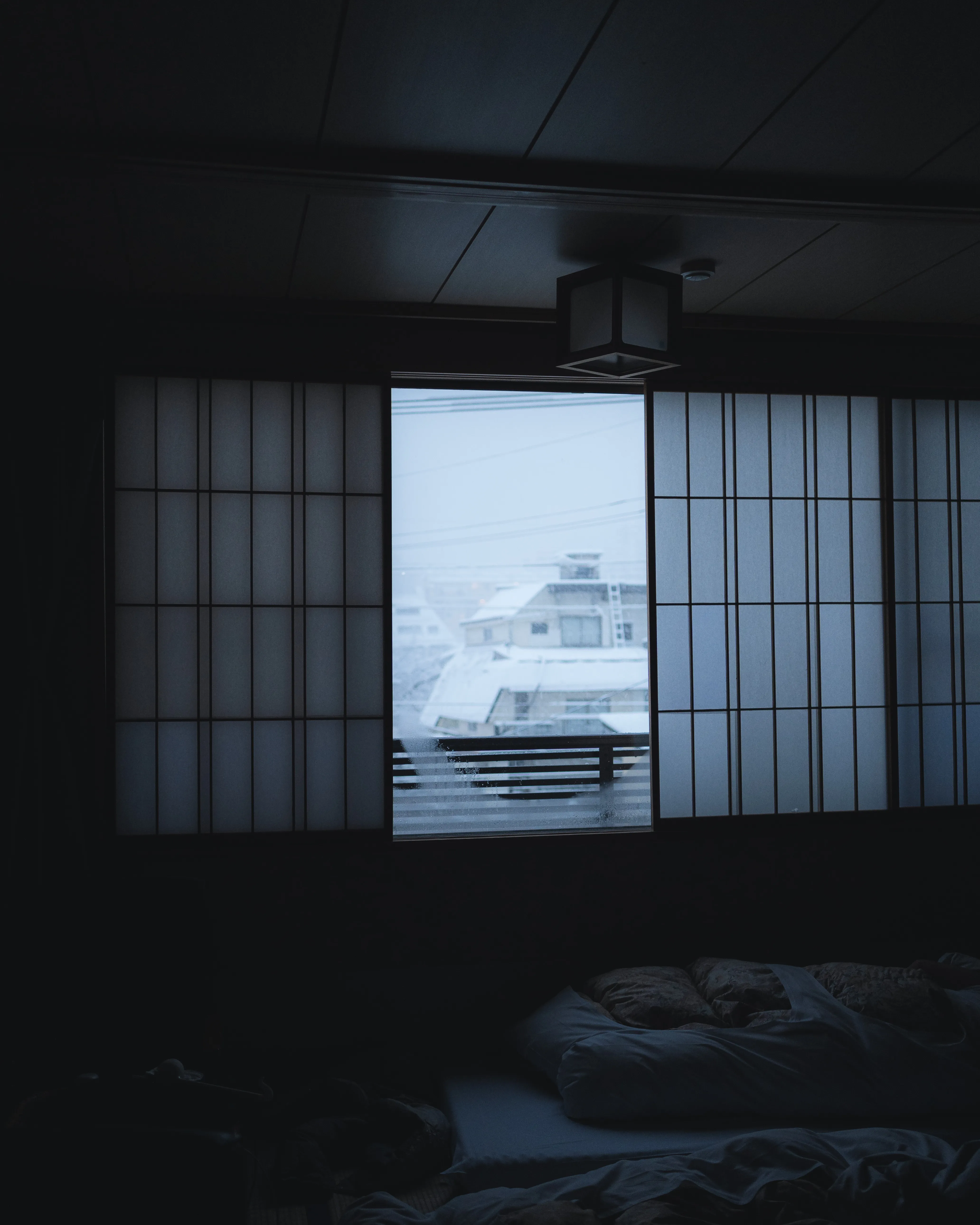 snow in early morning through window